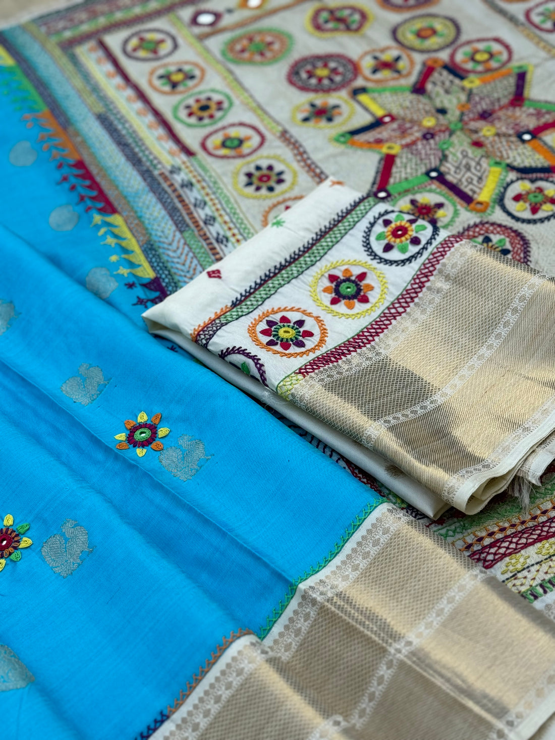 handwoven pure kanchivaram silk saree with korvai borders adorned with an exquisite handmade lambani mirror work