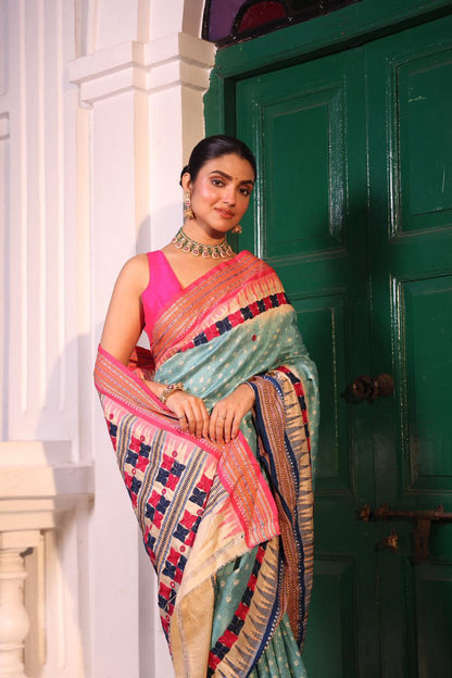 An exquisite handwoven vidharbha tussar silk saree with karvati kinar border intricately tie dyed with turquoise blue bhandhej and phulkari hand embroidered
