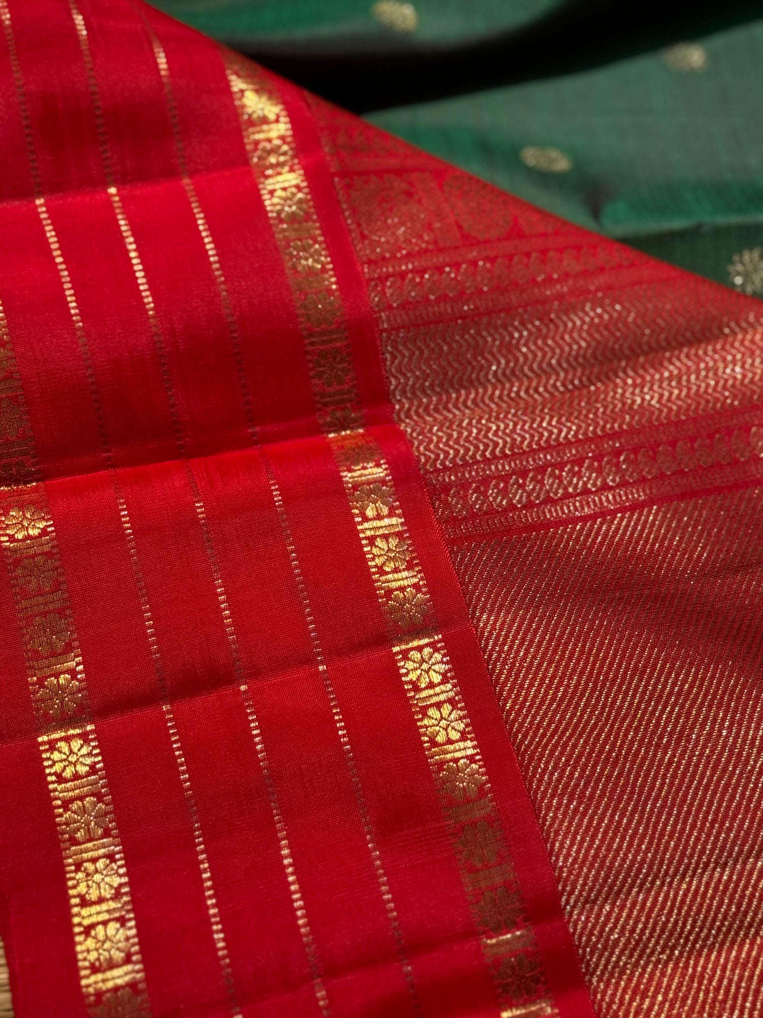 KADHAMBAM- The stunner handwoven bottle green with red korvai kanchivaram silk saree