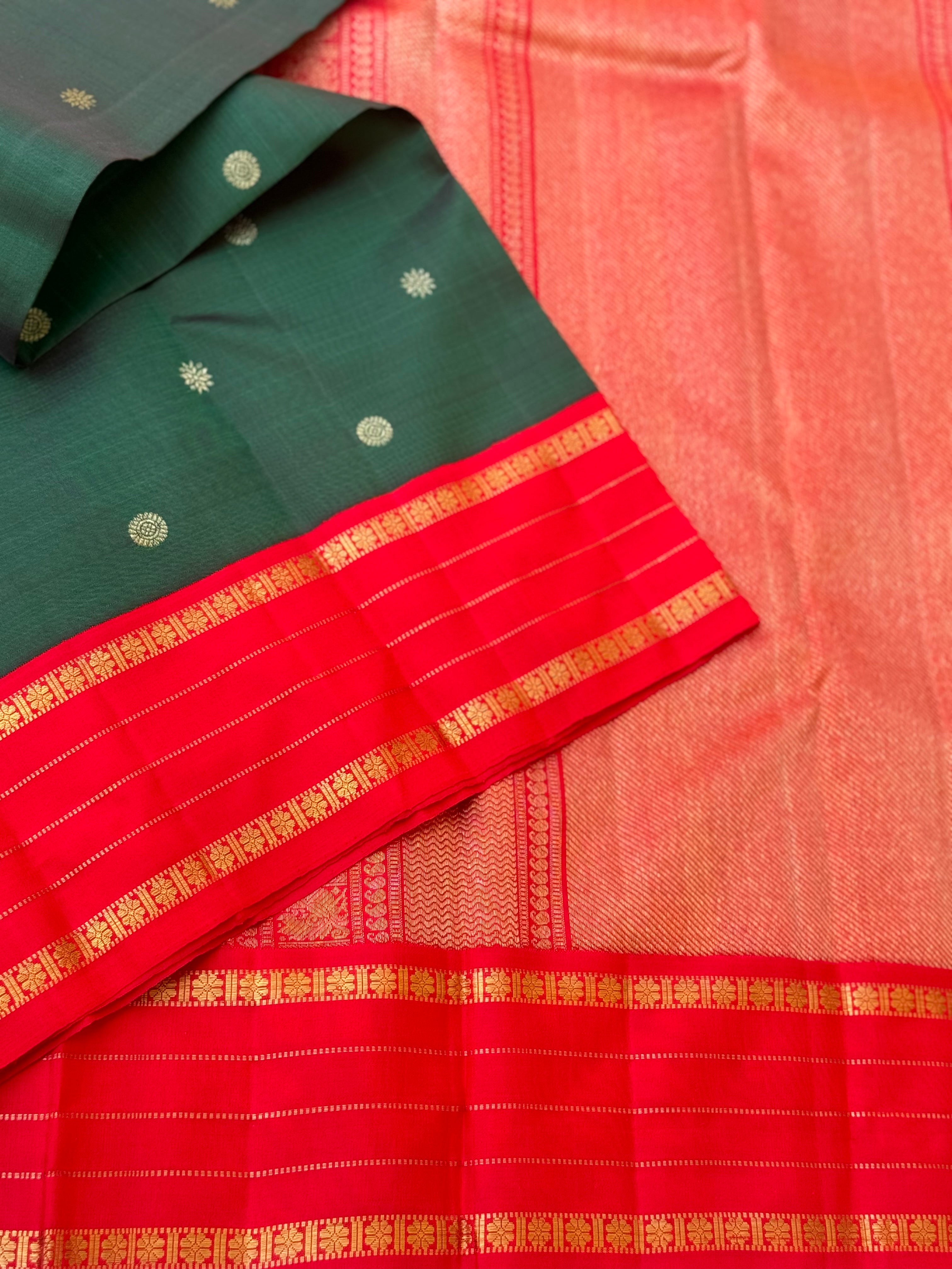 KADHAMBAM- The stunner handwoven bottle green with red korvai kanchivaram silk saree