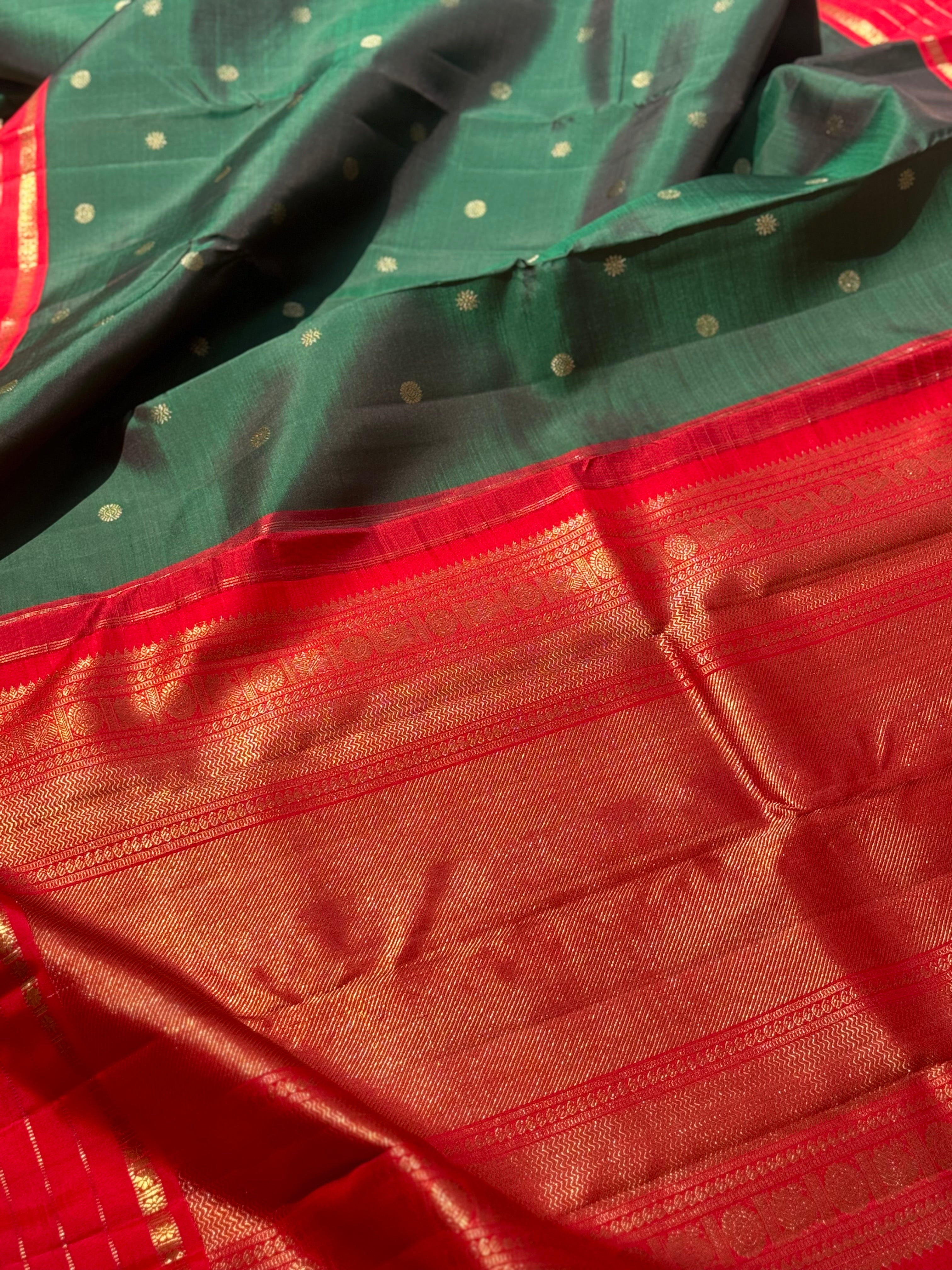 KADHAMBAM- The stunner handwoven bottle green with red korvai kanchivaram silk saree