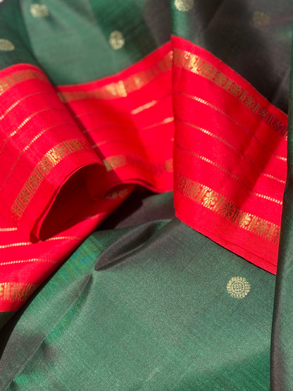 KADHAMBAM- The stunner handwoven bottle green with red korvai kanchivaram silk saree