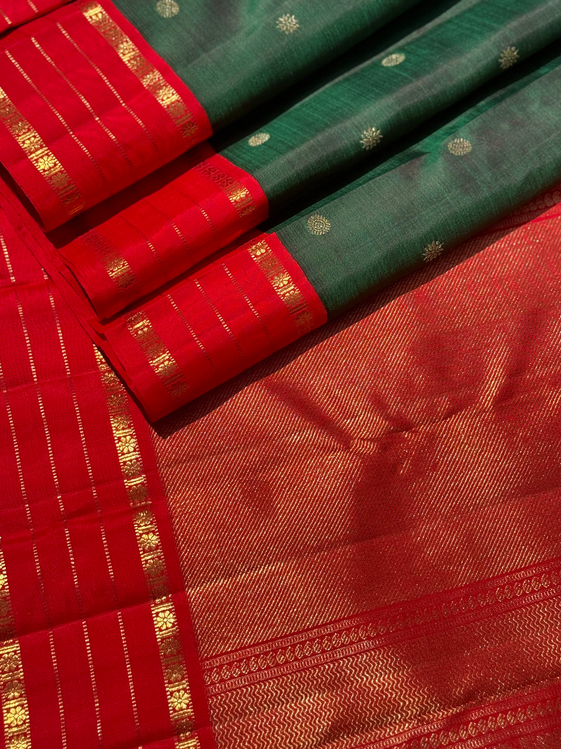 KADHAMBAM- The stunner handwoven bottle green with red korvai kanchivaram silk saree