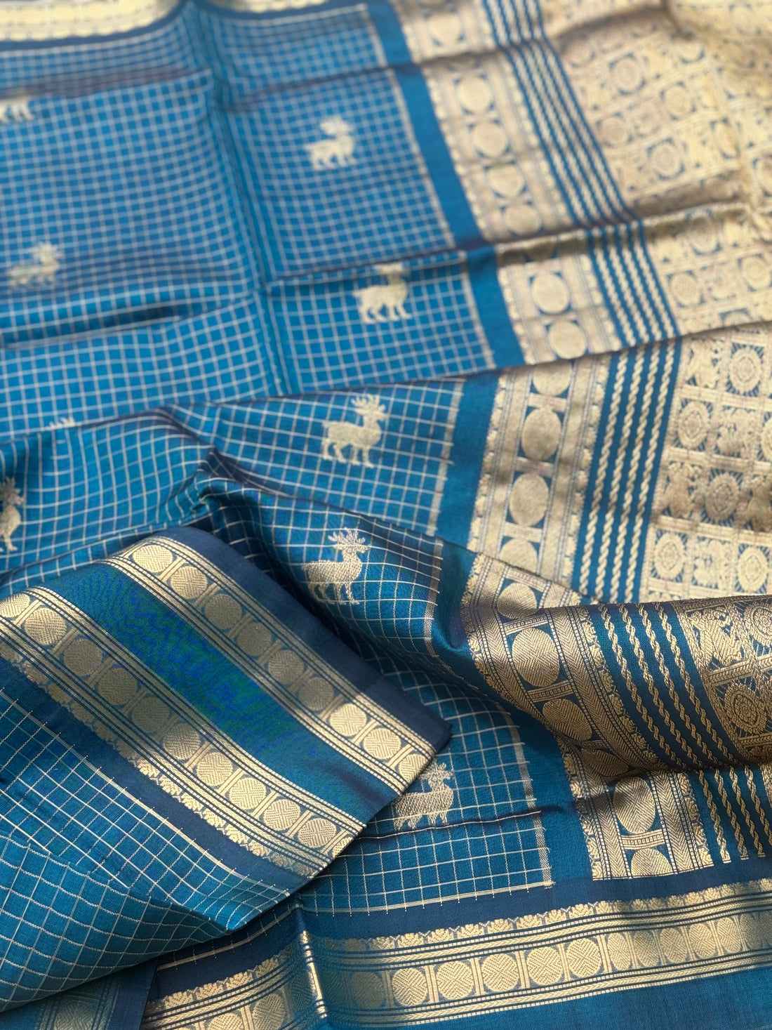 A gorgeous peacock blue shade handwoven zari checks with deer motifs Kanchi silk cotton saree