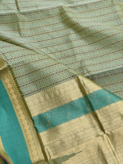 A gorgeous Pastel cyan green shade handwoven lakshadeepam kanchi silk cotton saree