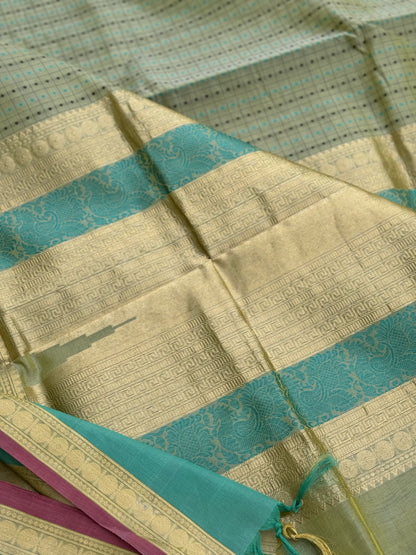 A gorgeous Pastel cyan green shade handwoven lakshadeepam kanchi silk cotton saree