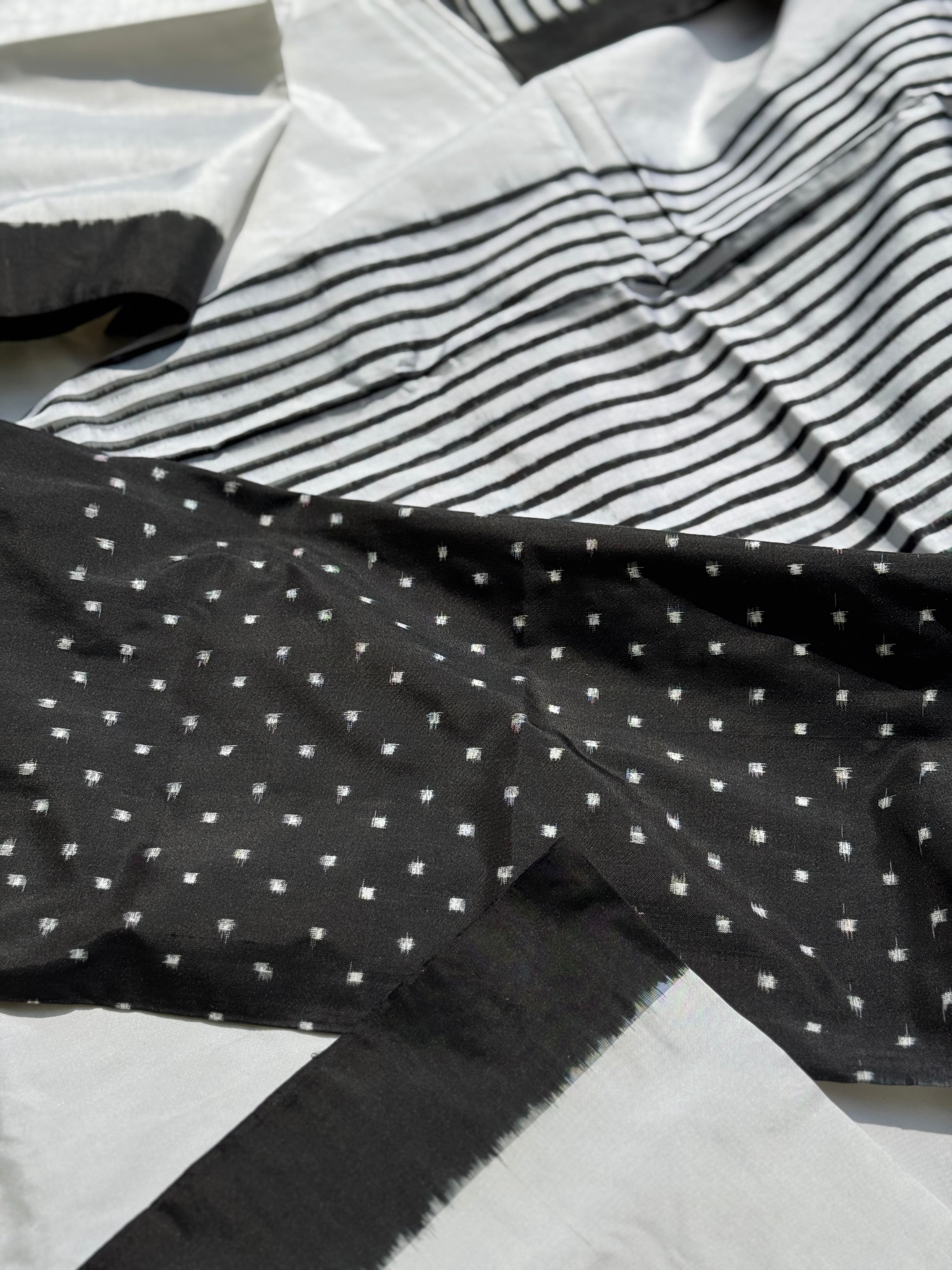 A double warp and weft tie dyed ikkat handwoven saree in pure mulberry silk with contemporary style of design