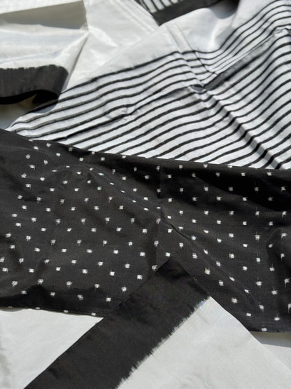 A double warp and weft tie dyed ikkat handwoven saree in pure mulberry silk with contemporary style of design