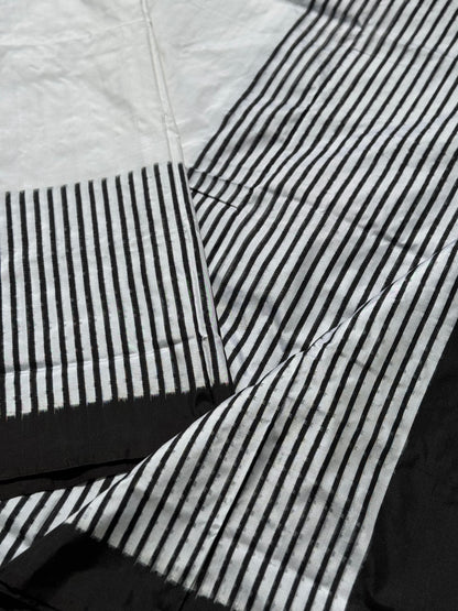 A double warp and weft tie dyed ikkat handwoven saree in pure mulberry silk with contemporary style of design