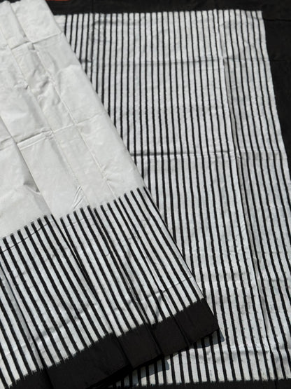 A double warp and weft tie dyed ikkat handwoven saree in pure mulberry silk with contemporary style of design