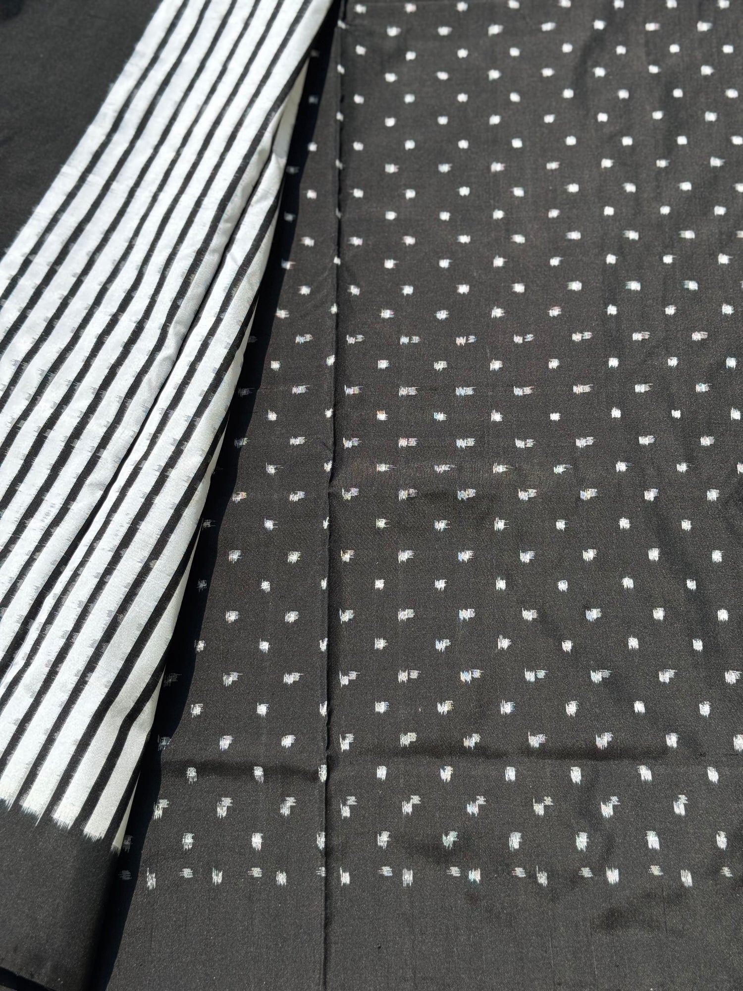 A double warp and weft tie dyed ikkat handwoven saree in pure mulberry silk with contemporary style of design