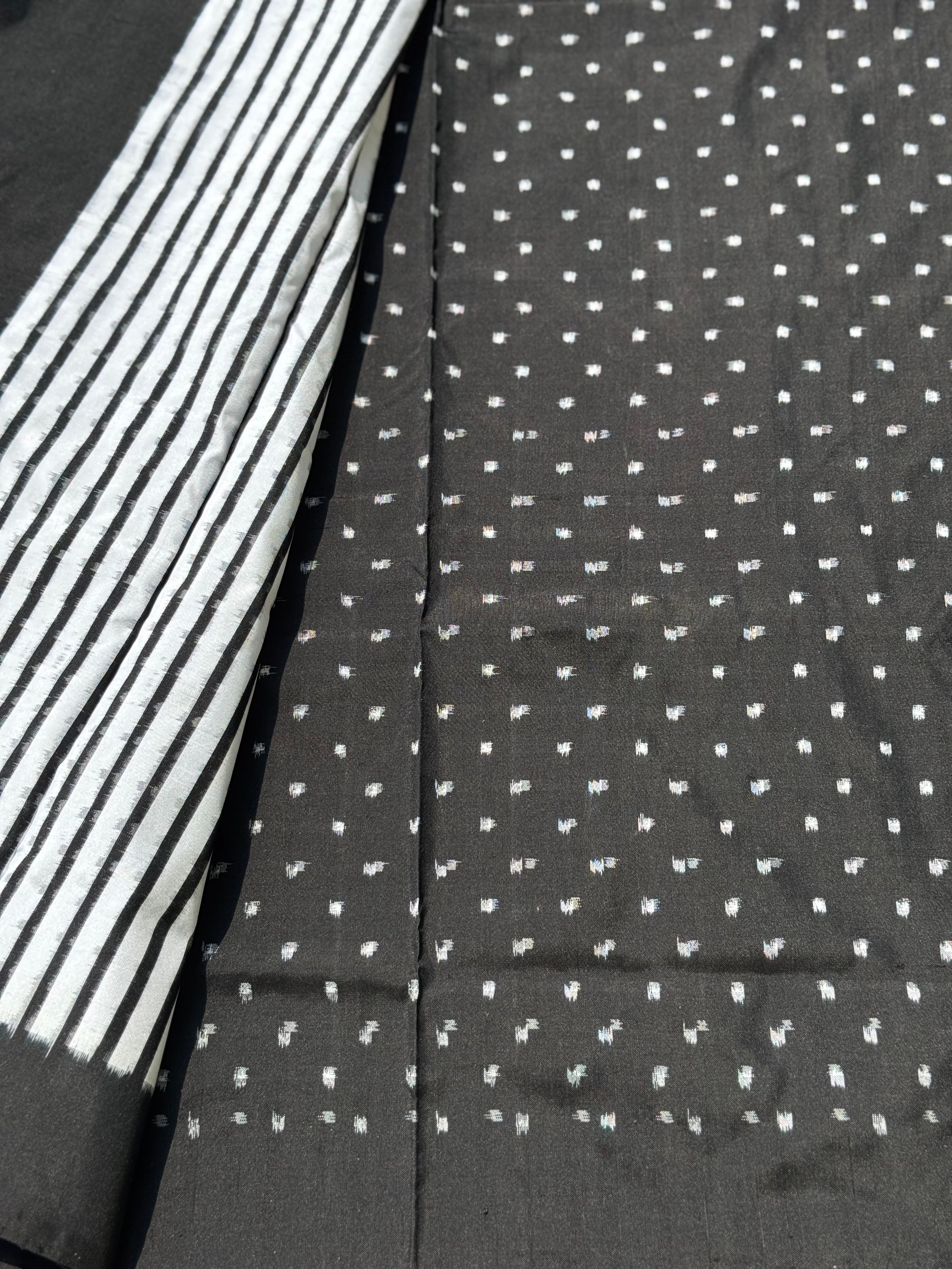 A double warp and weft tie dyed ikkat handwoven saree in pure mulberry silk with contemporary style of design