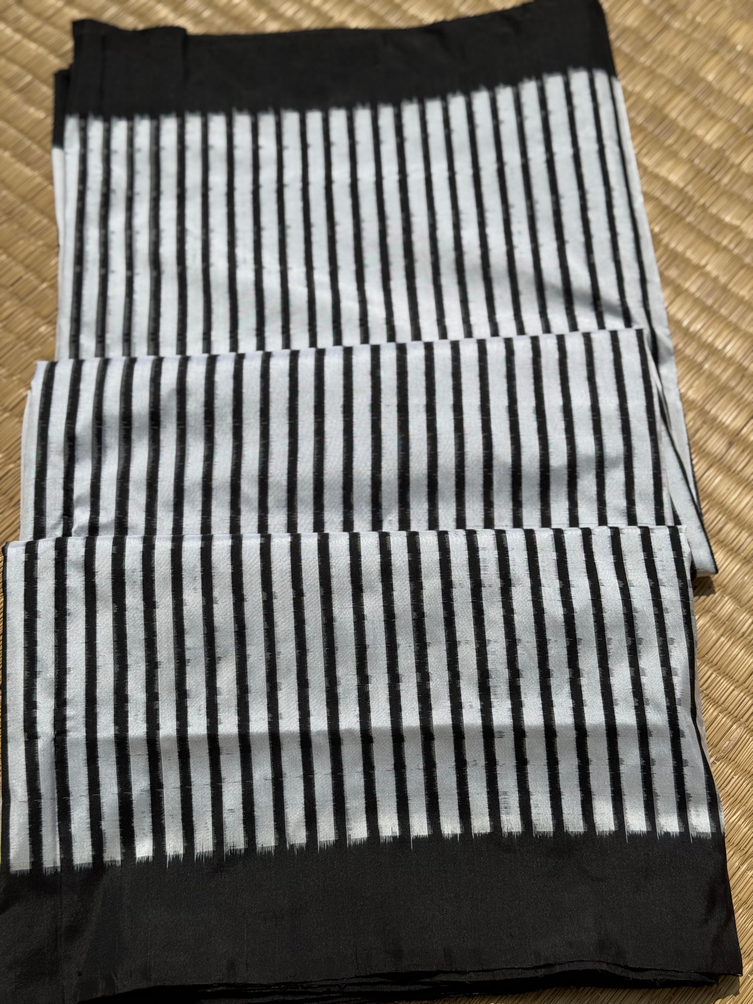 A double warp and weft tie dyed ikkat handwoven saree in pure mulberry silk with contemporary style of design