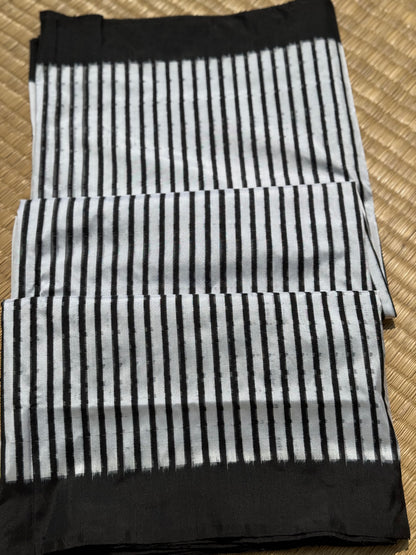 A double warp and weft tie dyed ikkat handwoven saree in pure mulberry silk with contemporary style of design