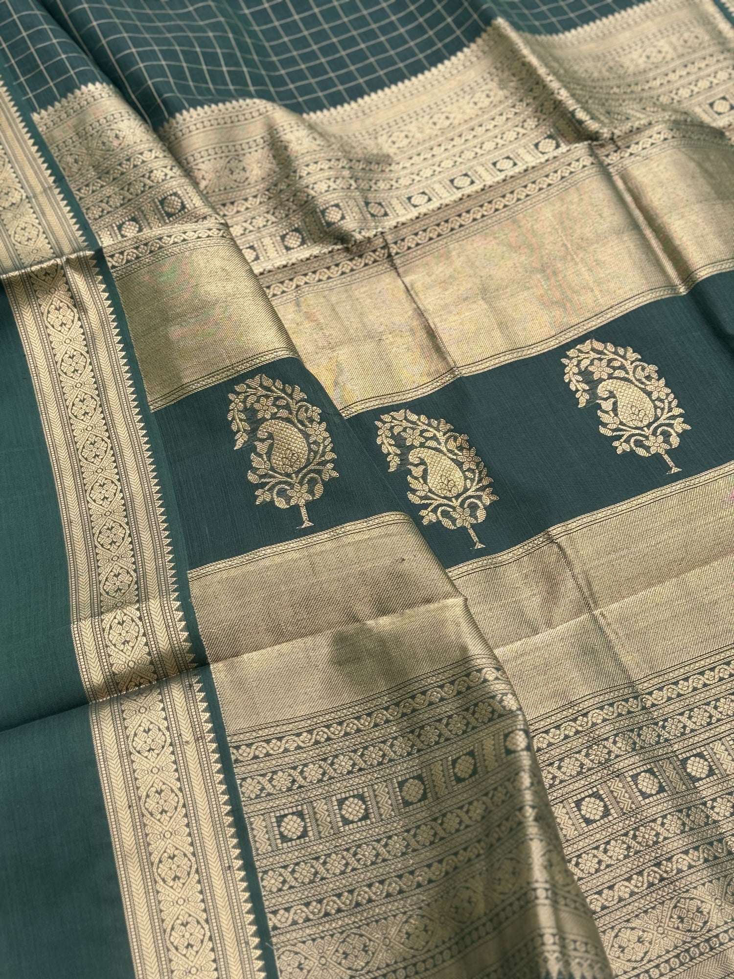 A gorgeous bottlegreen shade handwoven zari kattam Kanchi silk cotton saree