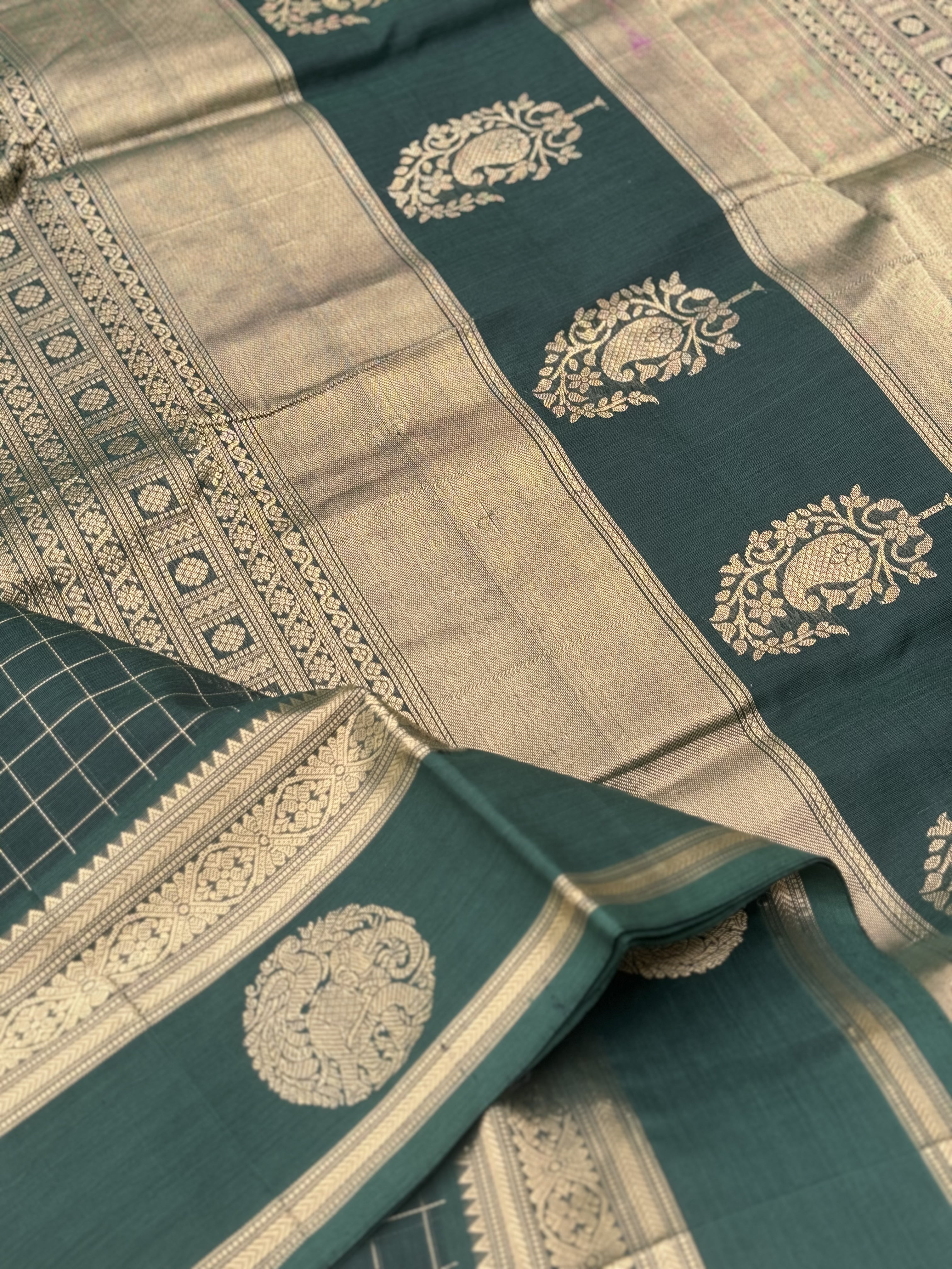 A gorgeous bottlegreen shade handwoven zari kattam Kanchi silk cotton saree