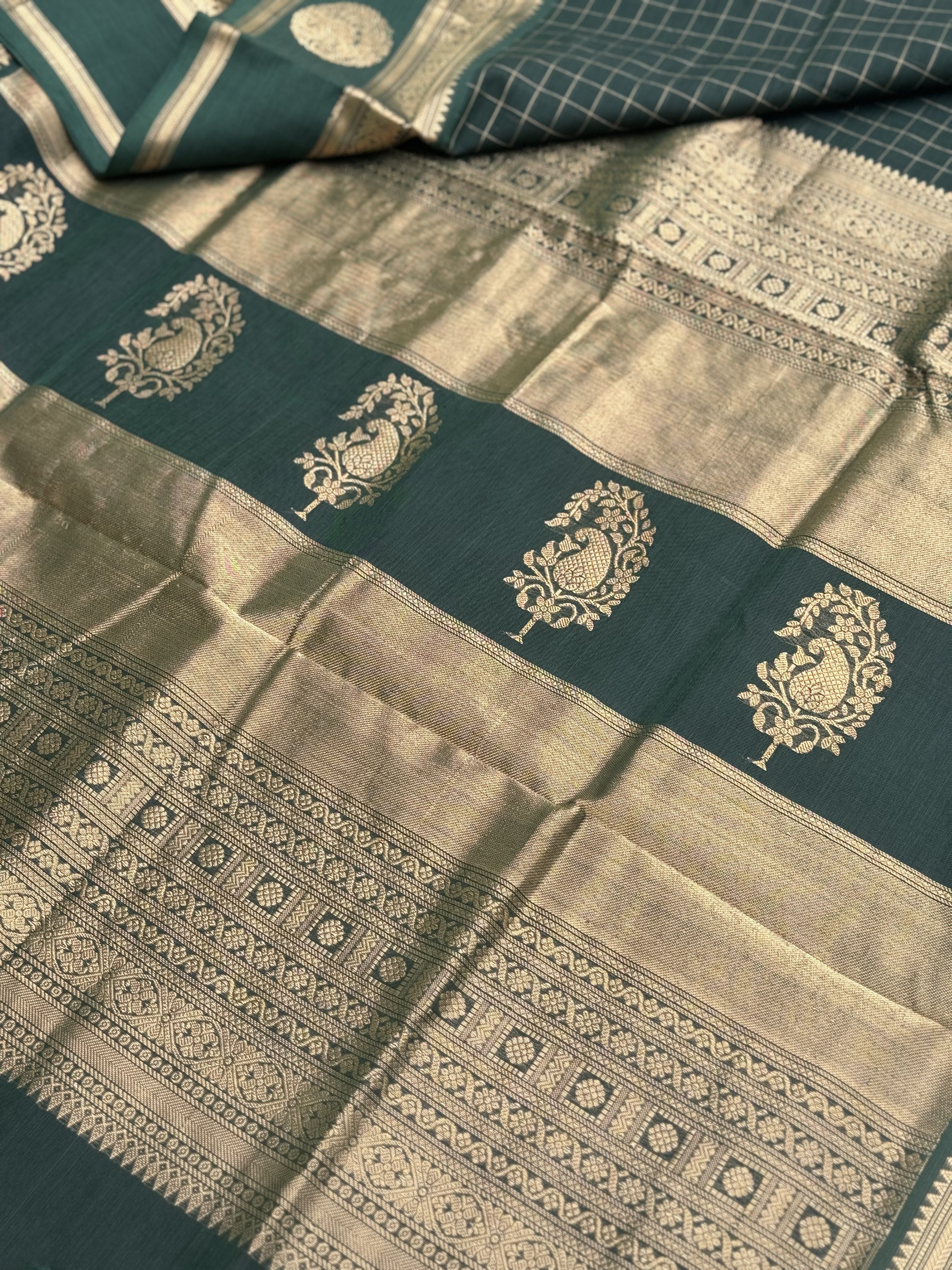 A gorgeous bottlegreen shade handwoven zari kattam Kanchi silk cotton saree