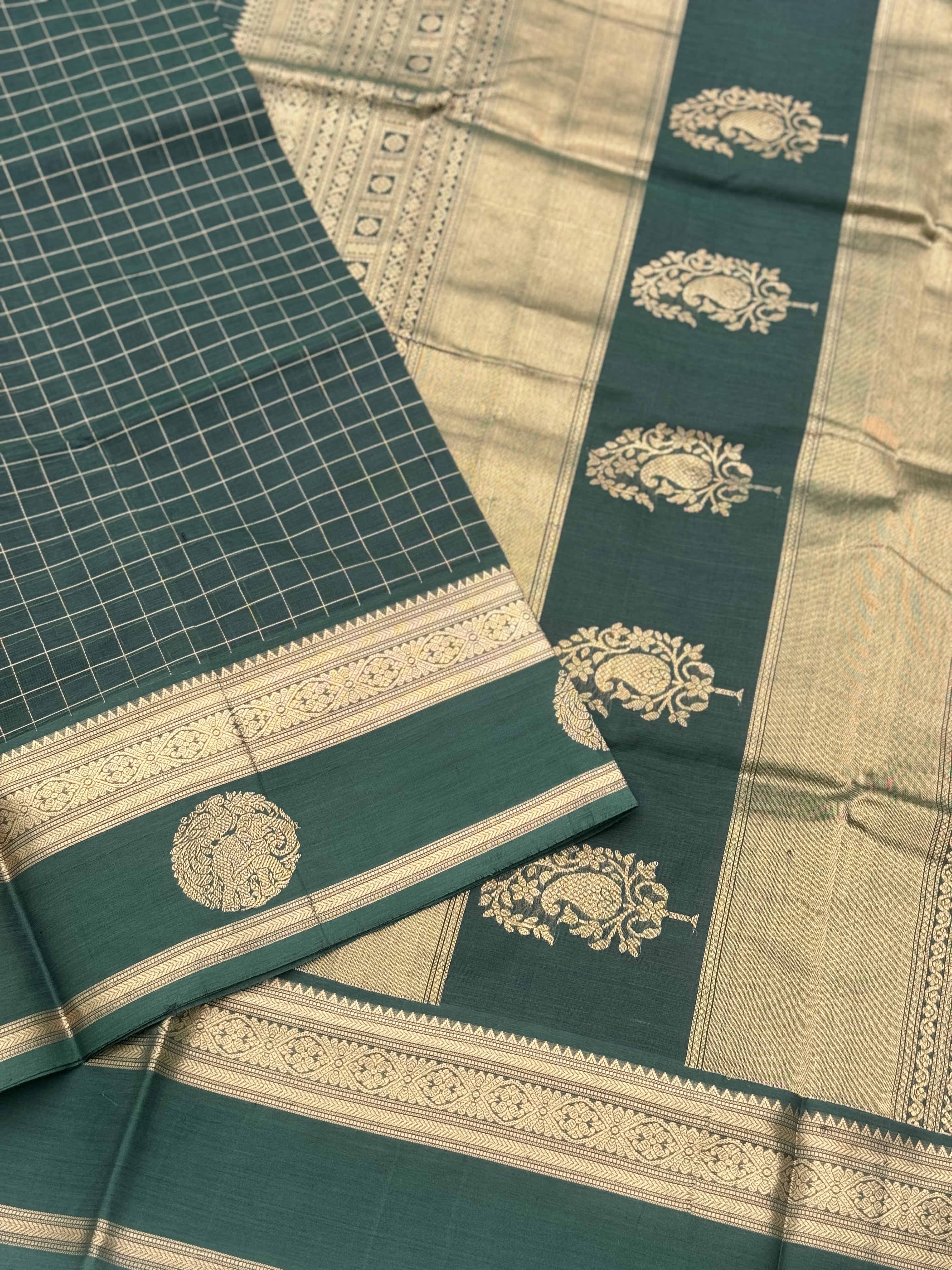 A gorgeous bottlegreen shade handwoven zari kattam Kanchi silk cotton saree