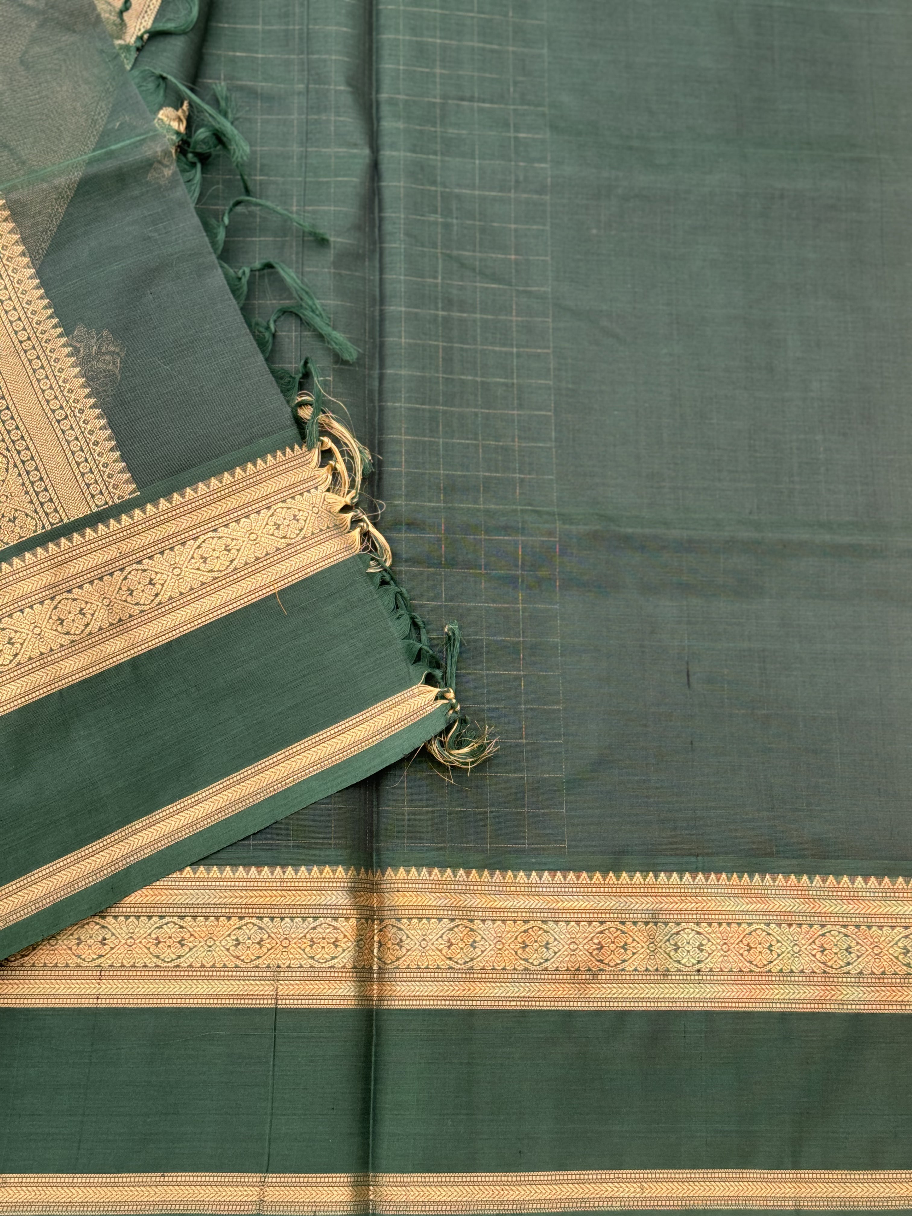 A gorgeous bottlegreen shade handwoven zari kattam Kanchi silk cotton saree