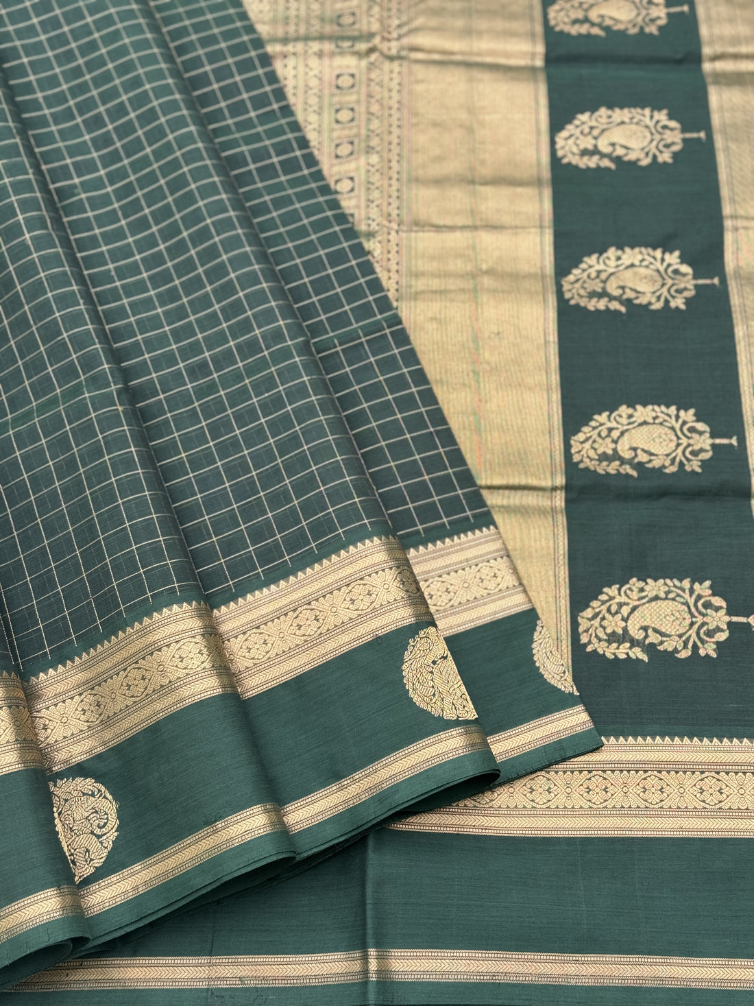 A gorgeous bottlegreen shade handwoven zari kattam Kanchi silk cotton saree