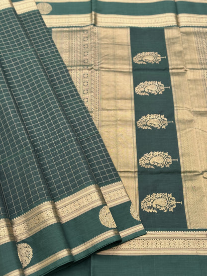 A gorgeous bottlegreen shade handwoven zari kattam Kanchi silk cotton saree