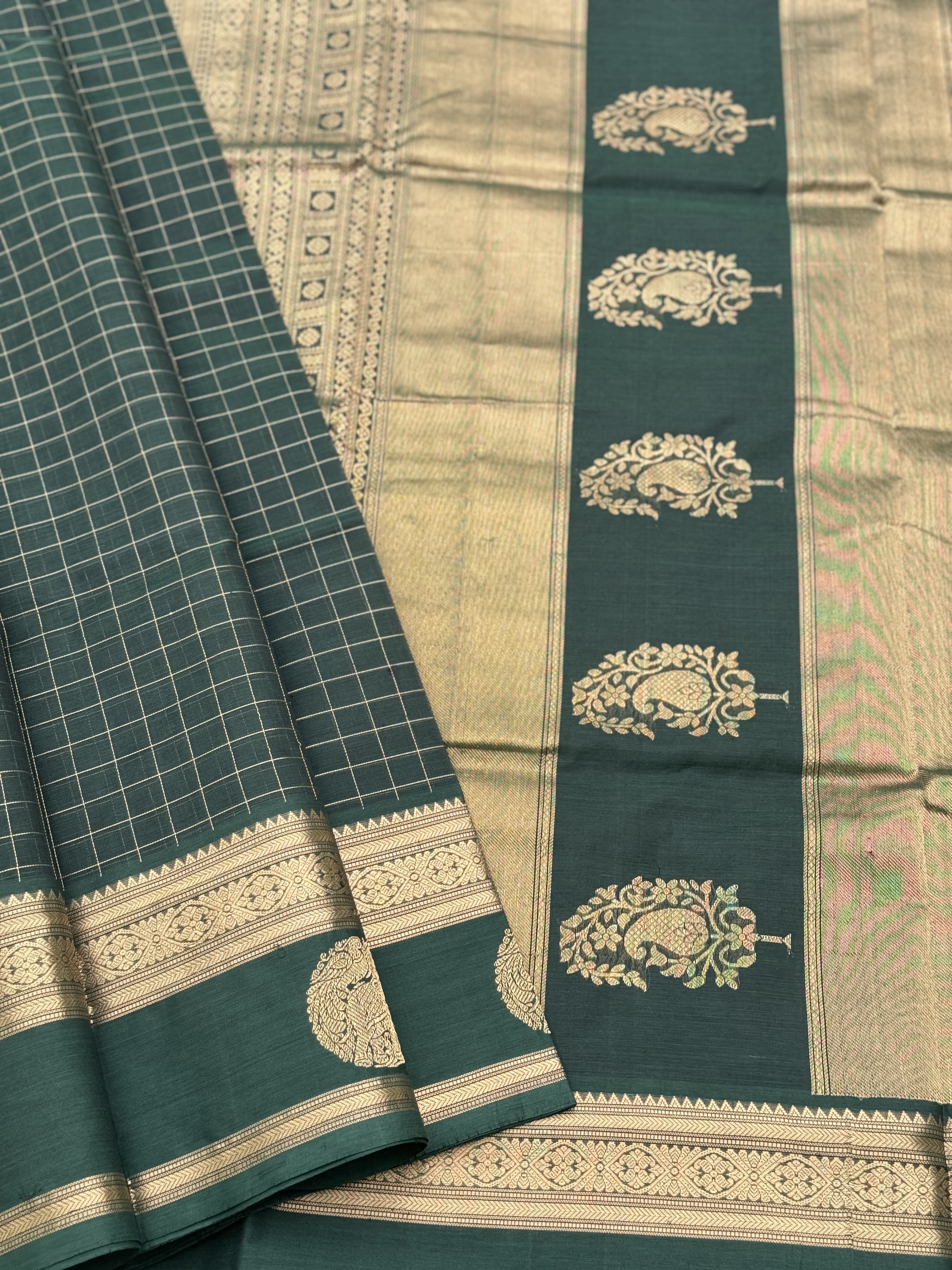 A gorgeous bottlegreen shade handwoven zari kattam Kanchi silk cotton saree