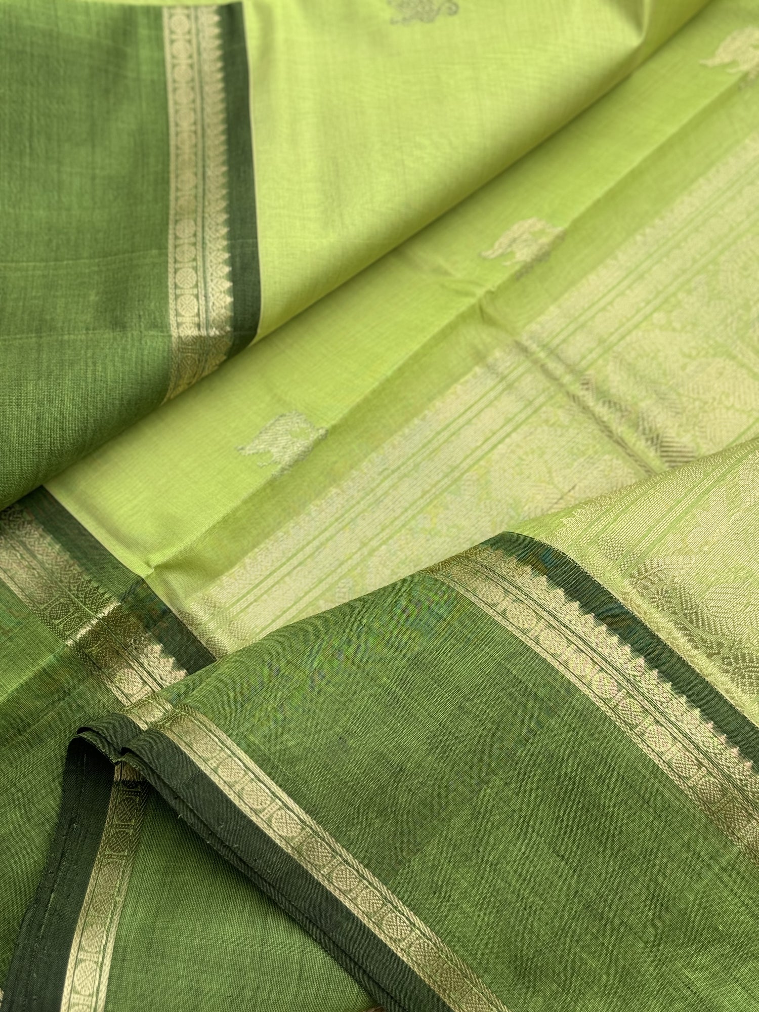 A gorgeous chartreuse green shade handwoven zari Kanchi silk cotton saree