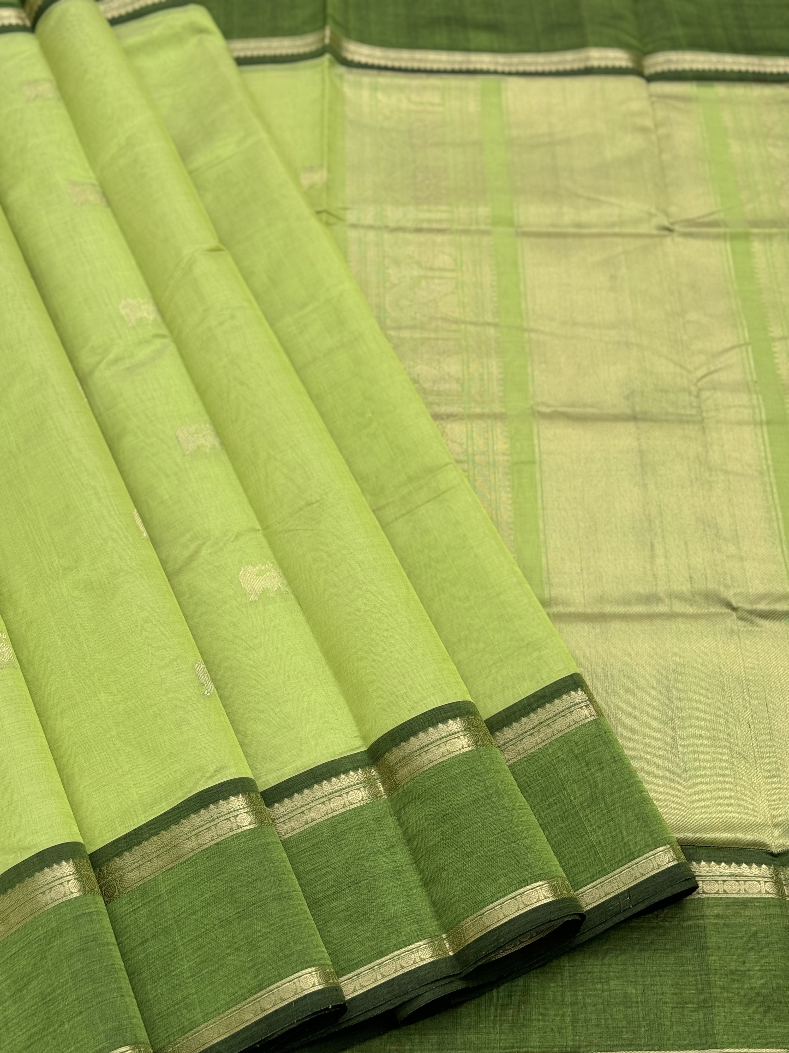 A gorgeous chartreuse green shade handwoven zari Kanchi silk cotton saree