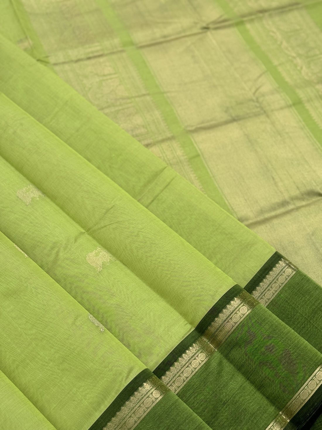 A gorgeous chartreuse green shade handwoven zari Kanchi silk cotton saree