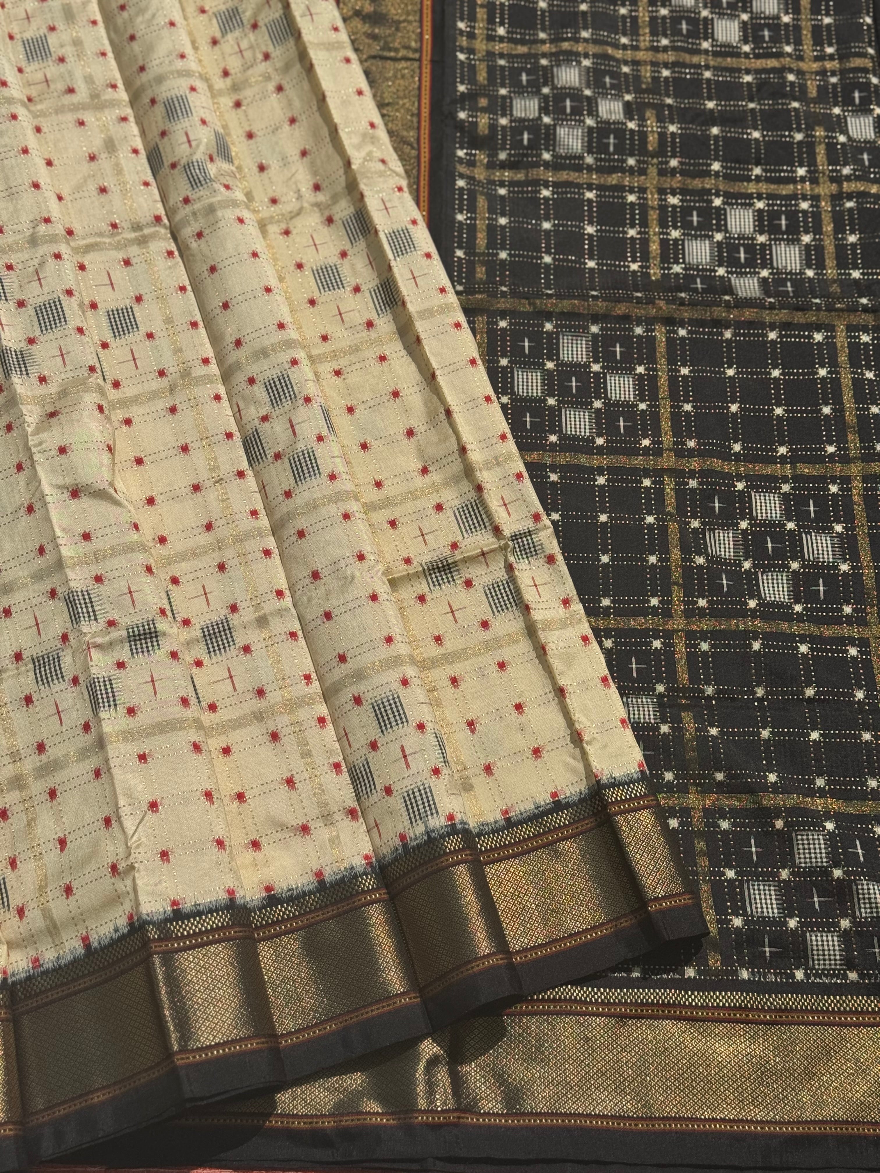A masterpiece and mastercrafted piece weft single ikkat tie dyed handwoven saree in pure mulberry silk with traditional zari checkS