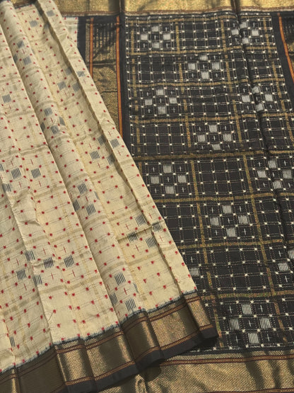 A masterpiece and mastercrafted piece weft single ikkat tie dyed handwoven saree in pure mulberry silk with traditional zari checkS