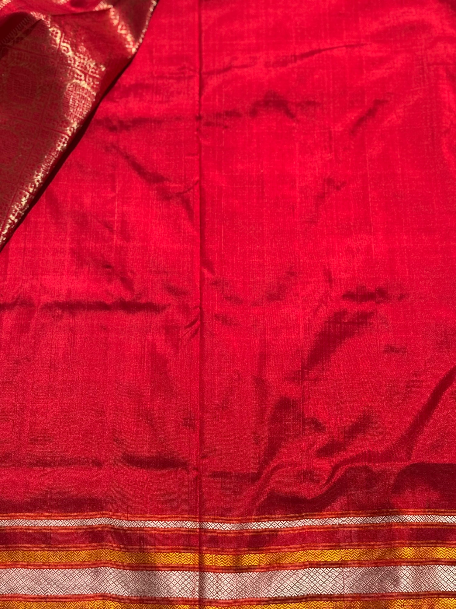 A masterpiece piece red shade weft single ikkat tie dyed handwoven saree in pure mulberry silk with traditional checks