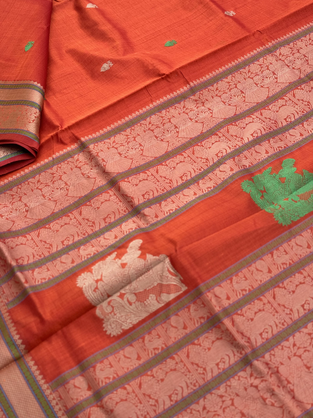 Gorgeous tangerine orange shade threadwork and zariwoven Kanchi silk Cotton Saree