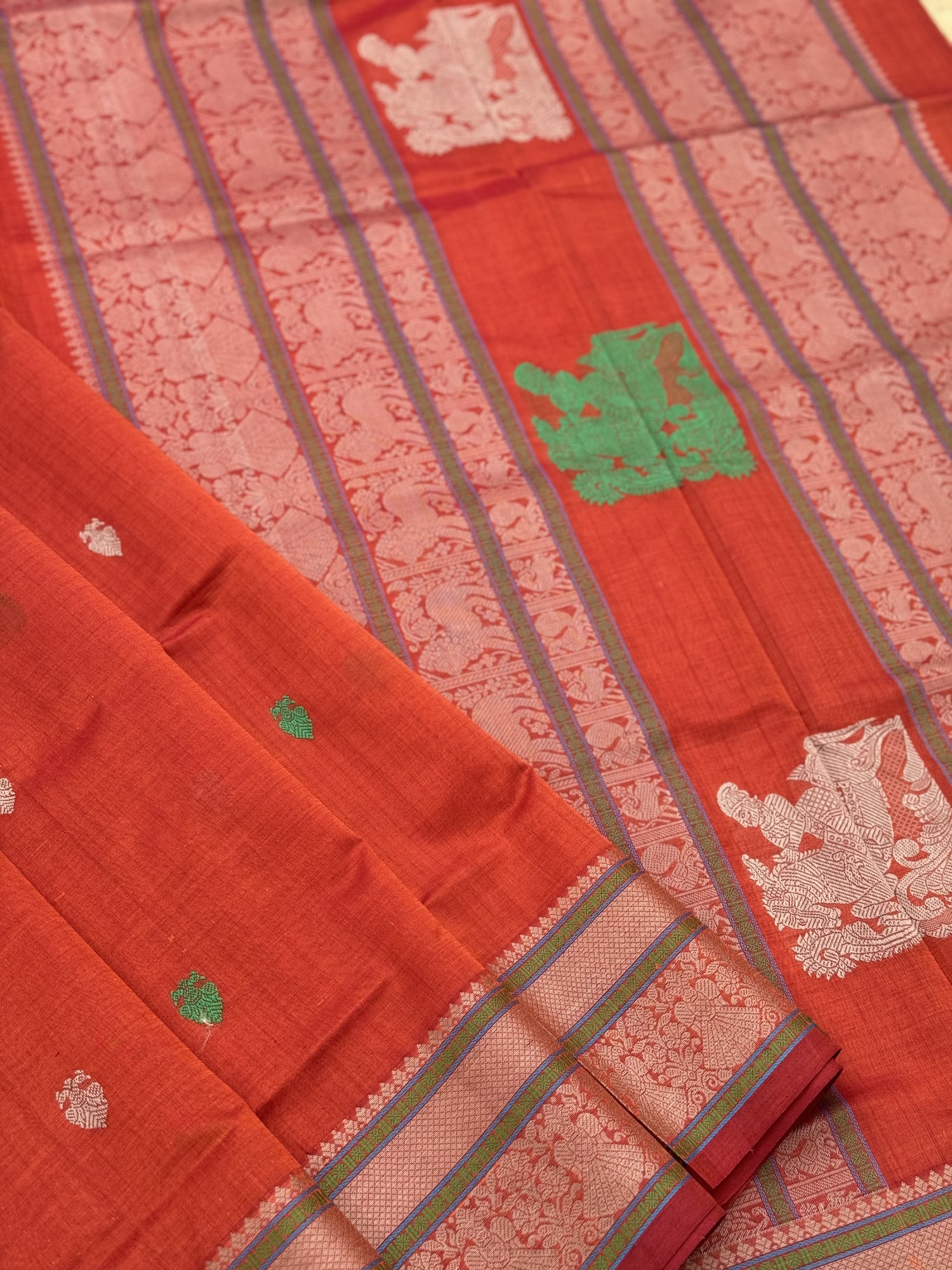 Gorgeous tangerine orange shade threadwork and zariwoven Kanchi silk Cotton Saree