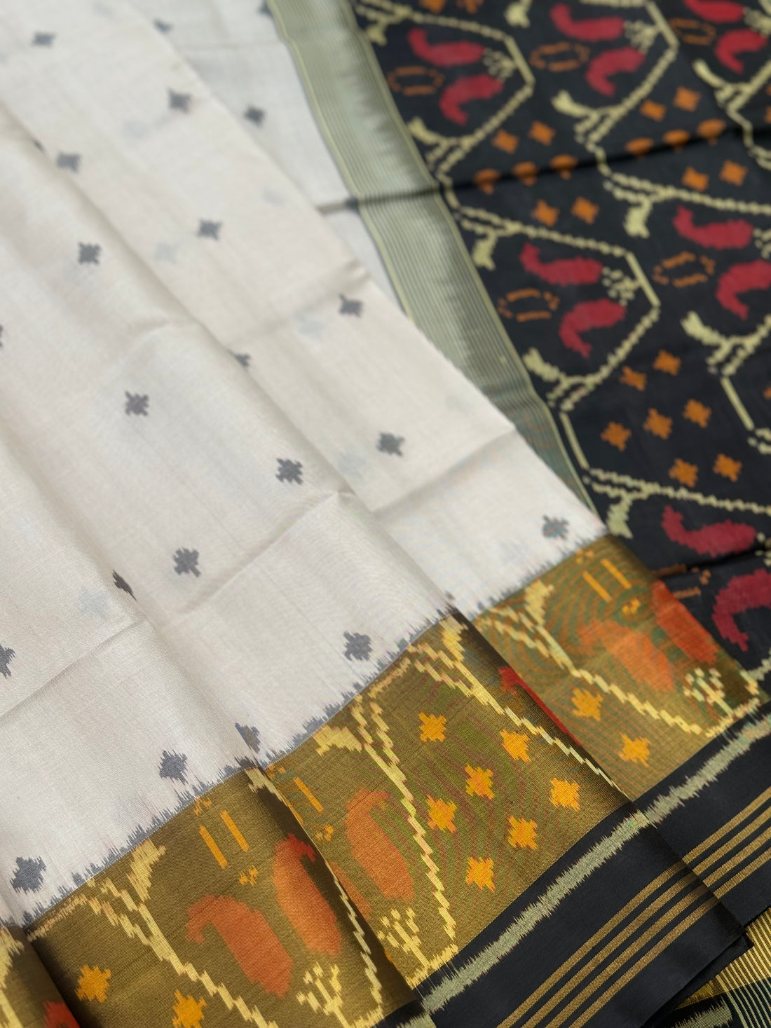 Ivory with black Patola single ikkat silk saree