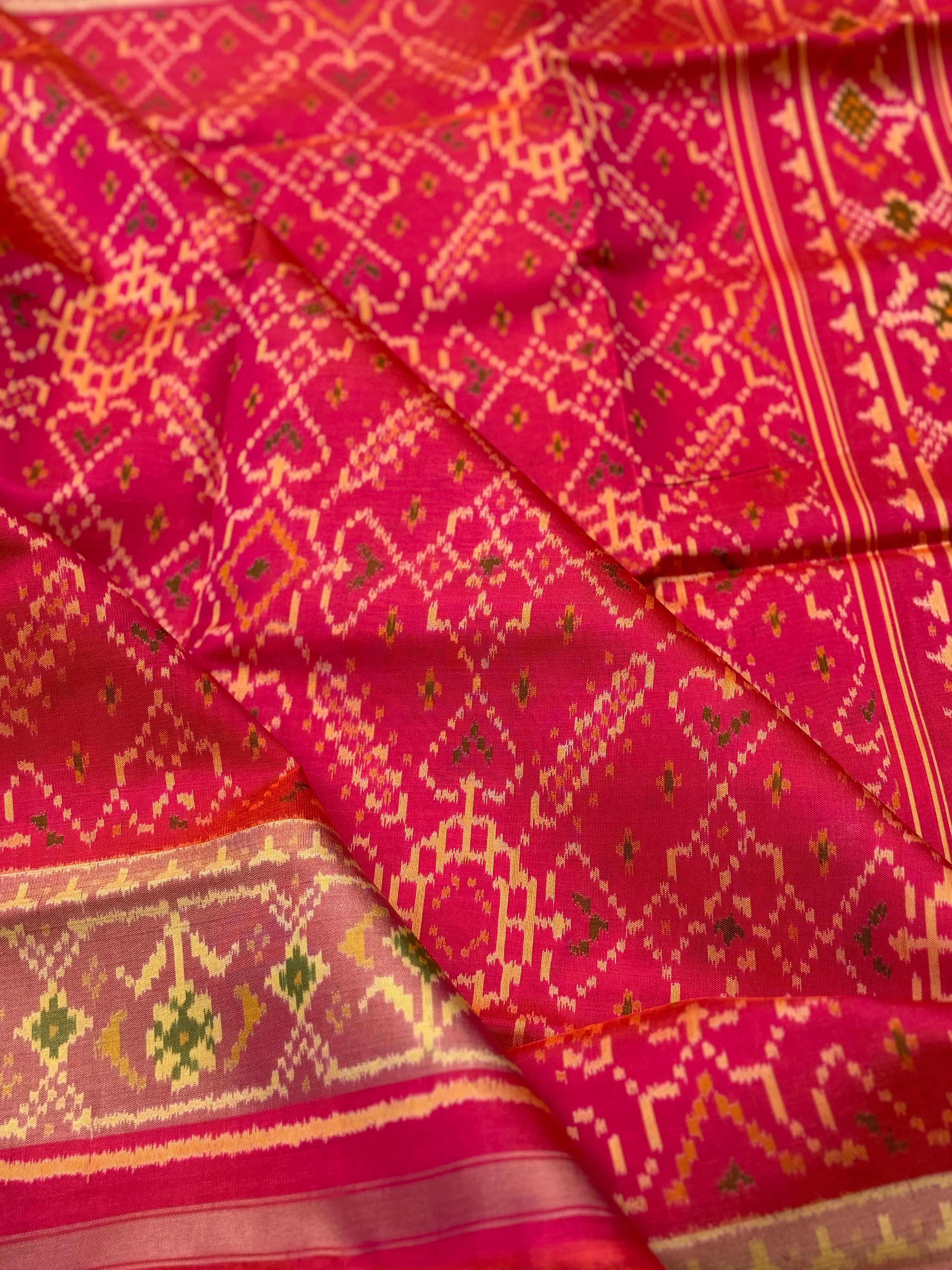 A gorgeous pink with red shade single ikkat patola silk SAREE