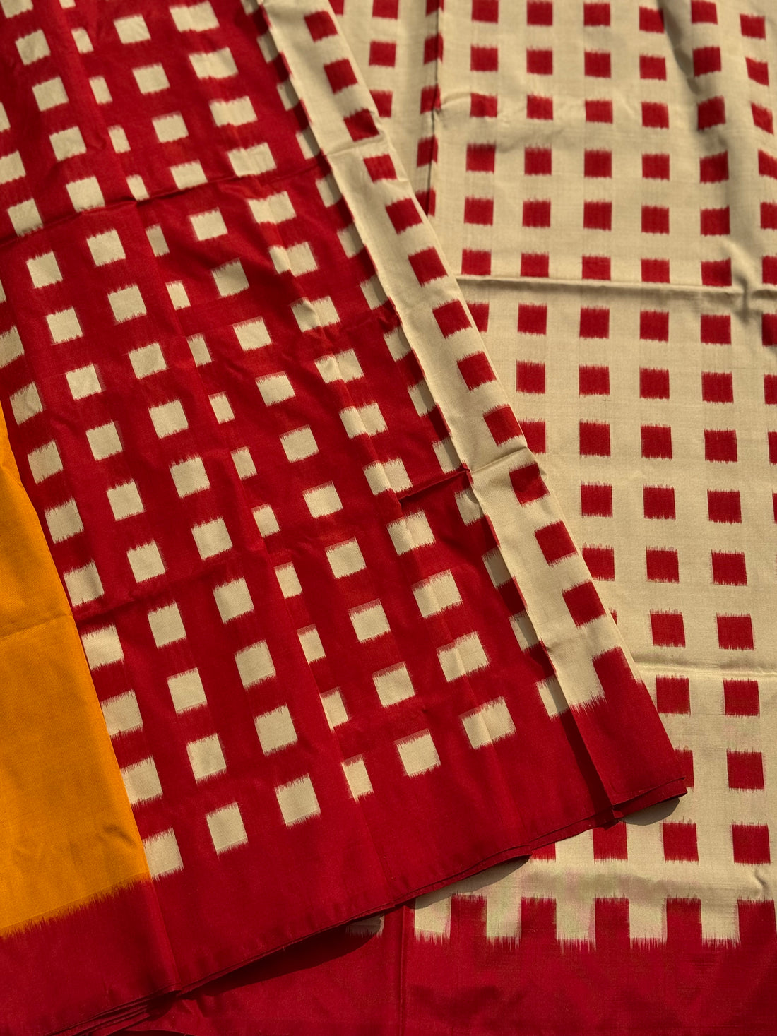 A contemporary take on solid block pattern double ikkat handwoven mulberry silk saree