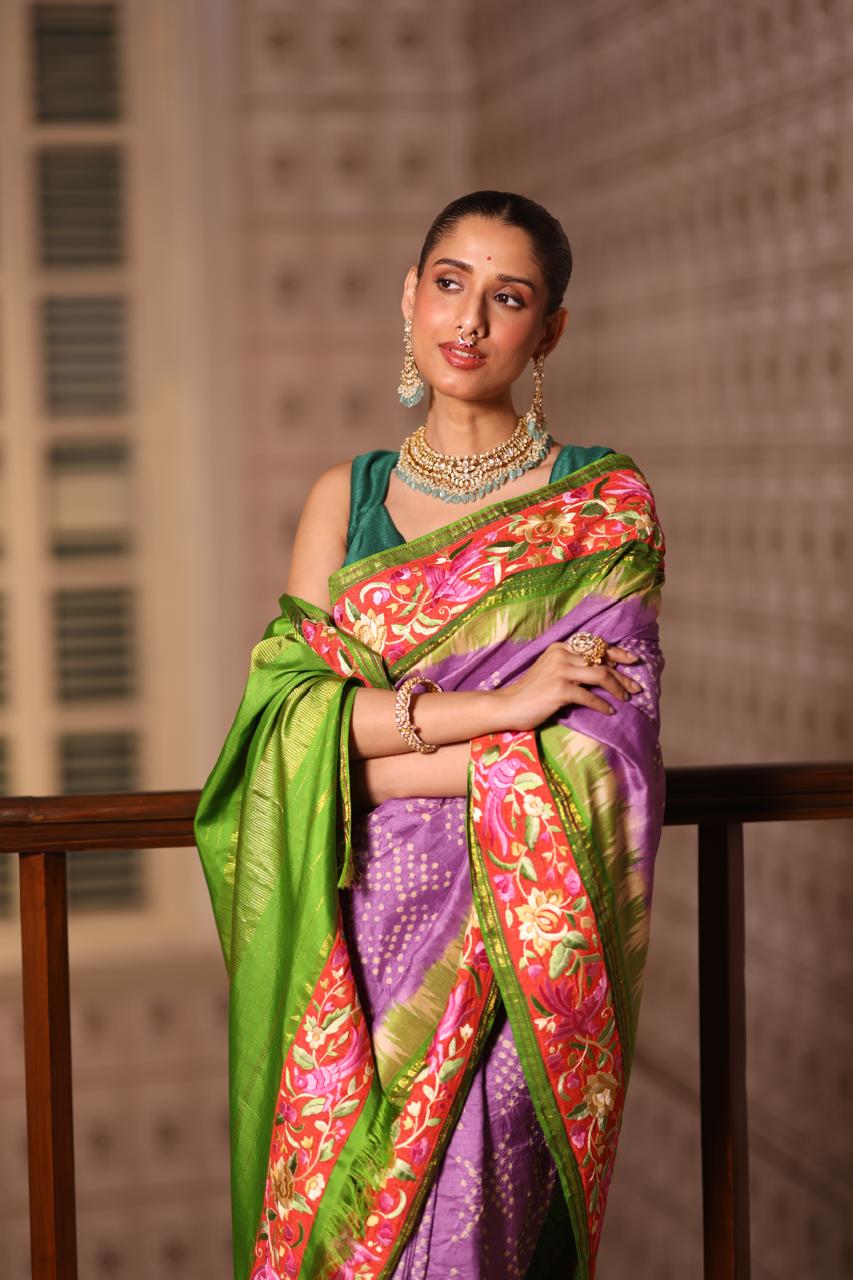 A stupendous kanchivaram silk saree in pastel lavender With hanknotted Bhandej and authentic Parsi Gara work handmade