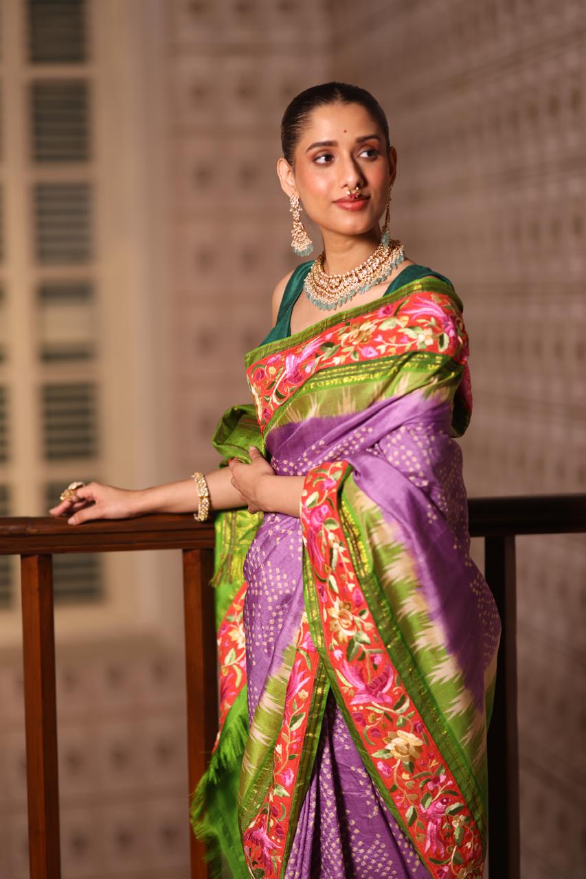 A stupendous kanchivaram silk saree in pastel lavender With hanknotted Bhandej and authentic Parsi Gara work handmade