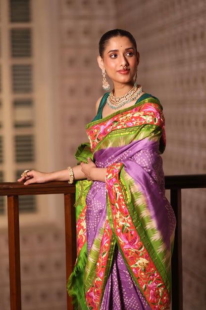 A stupendous kanchivaram silk saree in pastel lavender With hanknotted Bhandej and authentic Parsi Gara work handmade