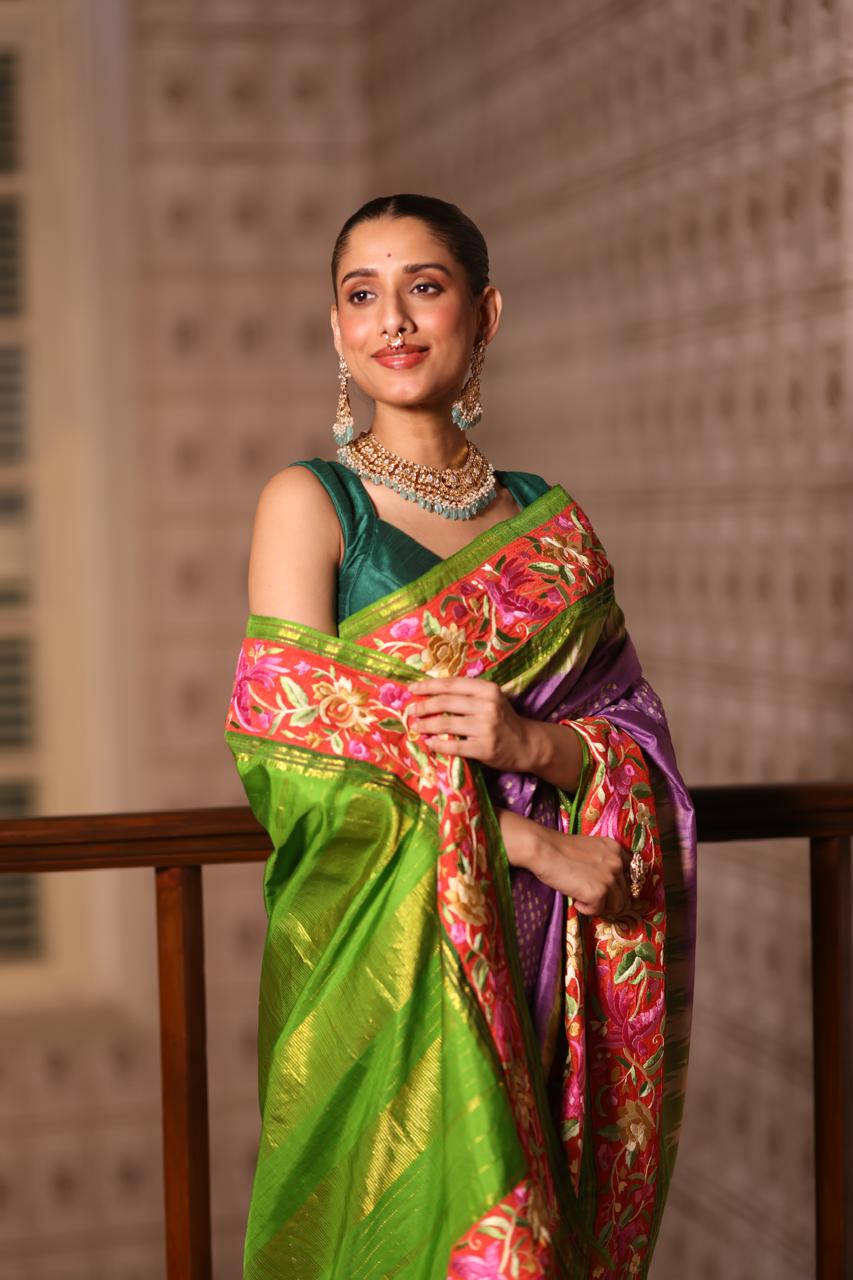 A stupendous kanchivaram silk saree in pastel lavender With hanknotted Bhandej and authentic Parsi Gara work handmade