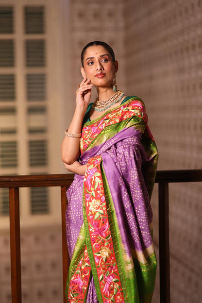 A stupendous kanchivaram silk saree in pastel lavender With hanknotted Bhandej and authentic Parsi Gara work handmade
