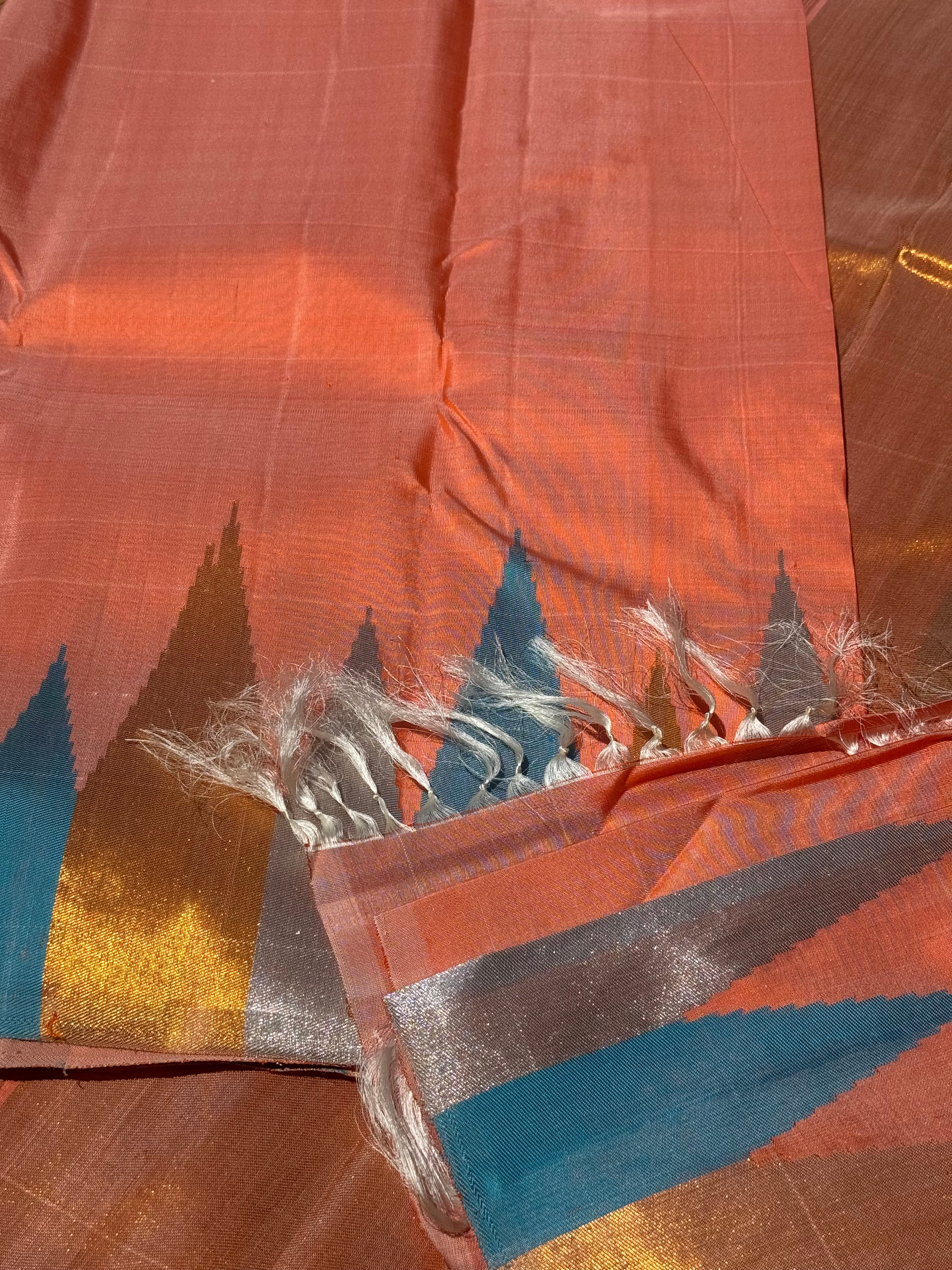 A handwoven salmon shade ettukol kanchivaram silk saree