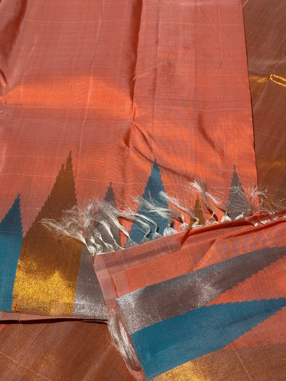 A handwoven salmon shade ettukol kanchivaram silk saree