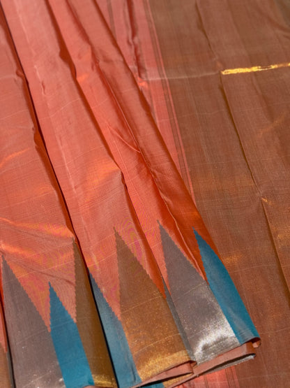 A handwoven salmon shade ettukol kanchivaram silk saree