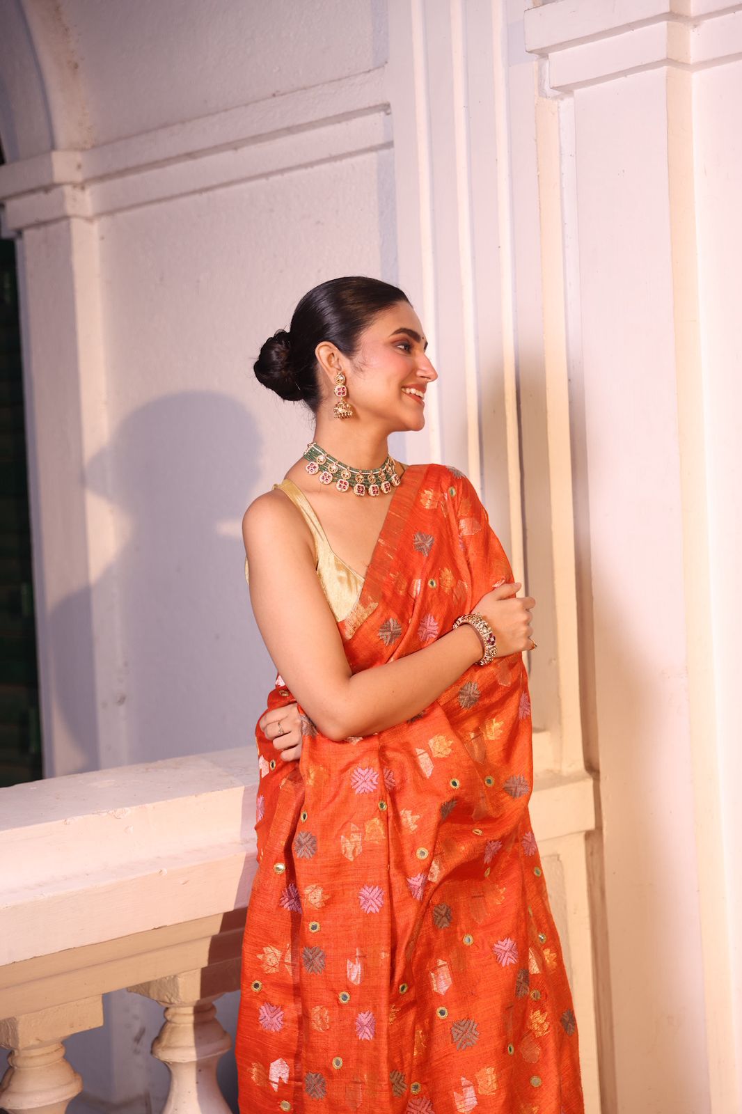 A rust orange matka tussar handwoven silk saree with hand embroidery phulkari work