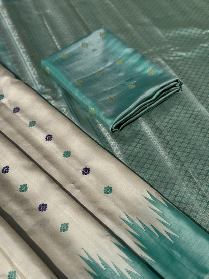 A gorgeous Pearlwhite with seagreen border temple korvai / kuttu handwoven Gadwal silk saree