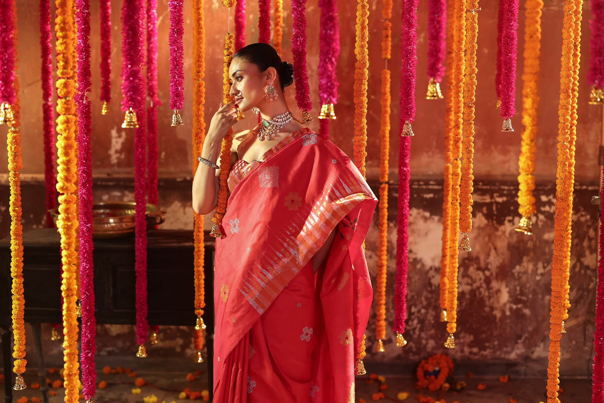 A designer exclusive Chilli Red shade ettukol kanchivaram silk saree with kasuti hand embroidery