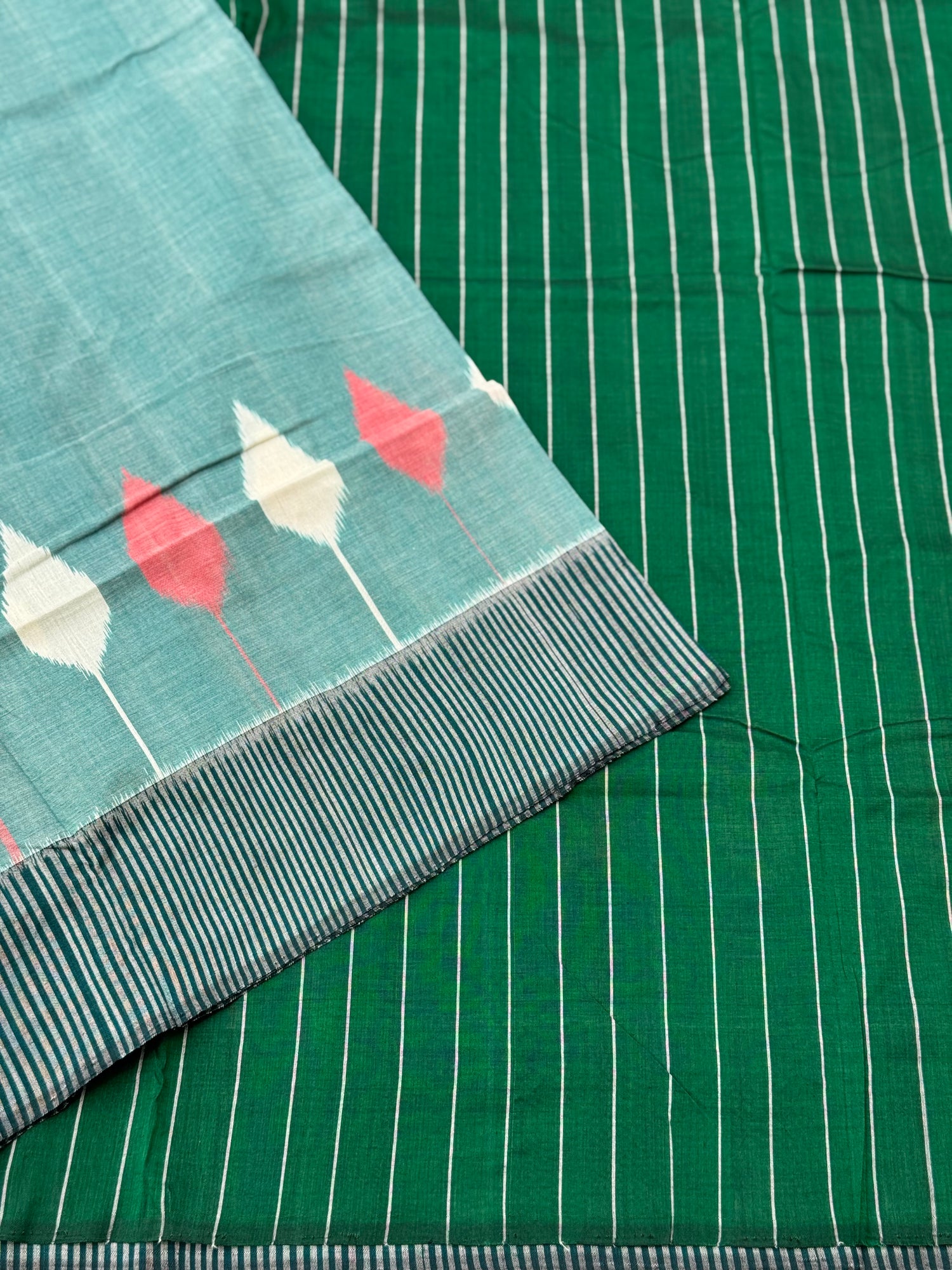 Teal green white handwoven weft single ikkat cotton saree