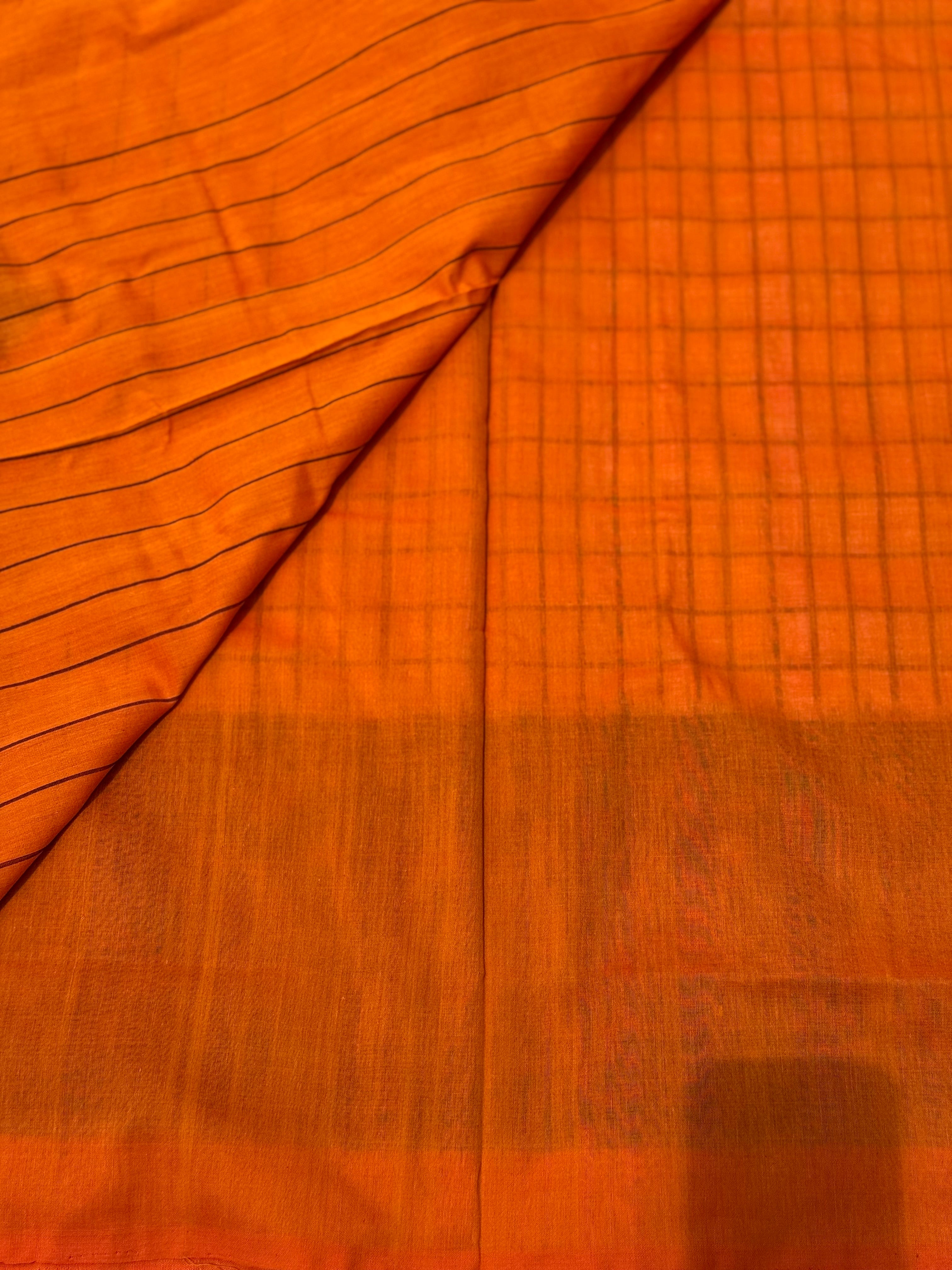 White checks with orange black handwoven weft single ikkat cotton saree